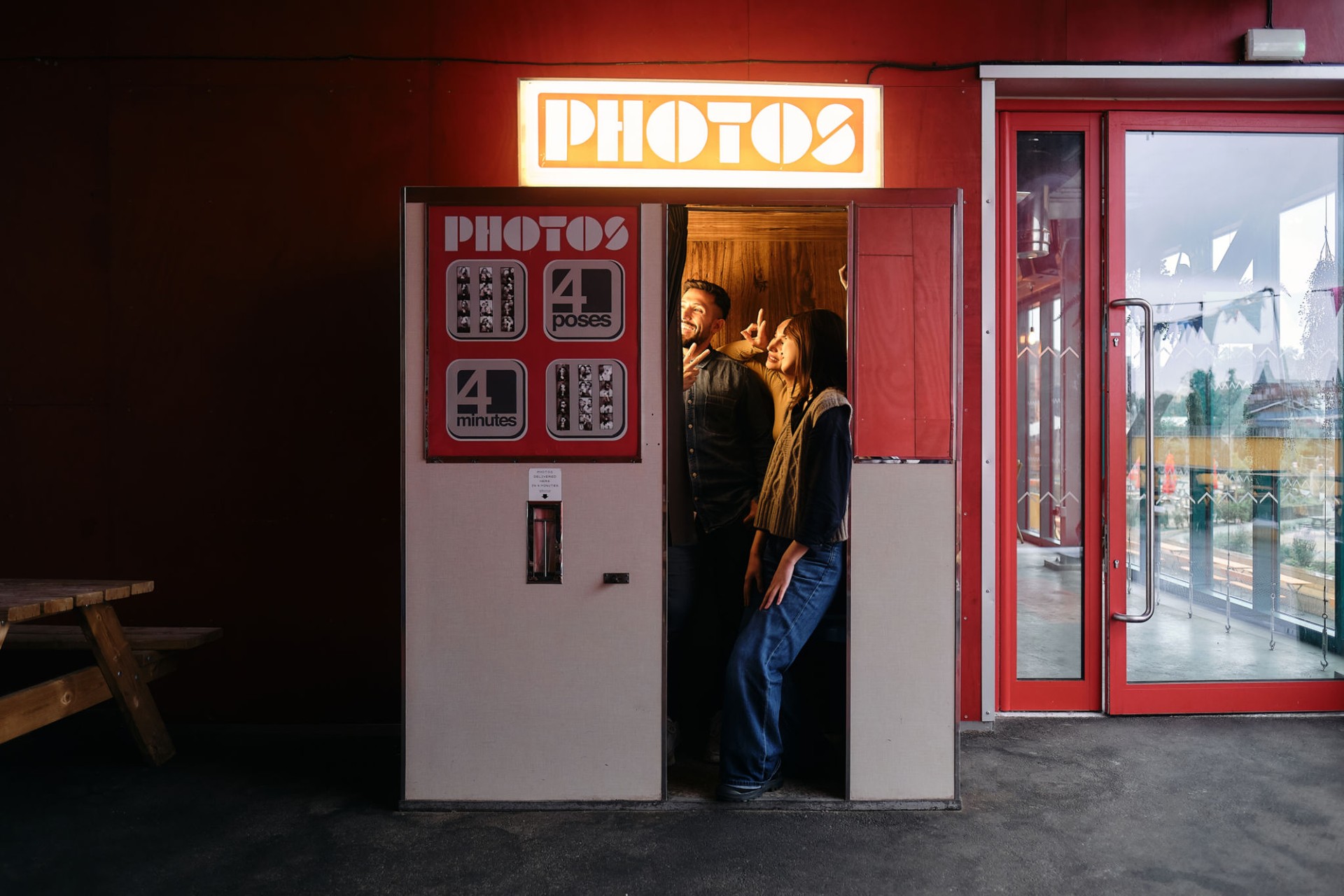 Group of friends taking a photo at the photobooth